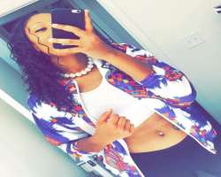 She has a piercing in her belly button.
